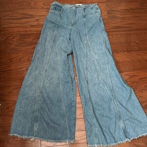 We the Free wide leg jeans with raw bottom edge.